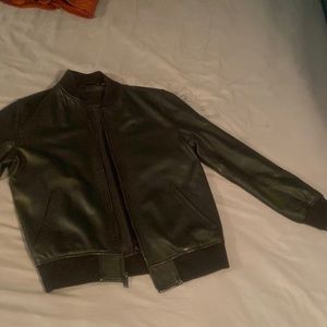 Genuine black leather jacket. Always kept clean and well placed in my closet